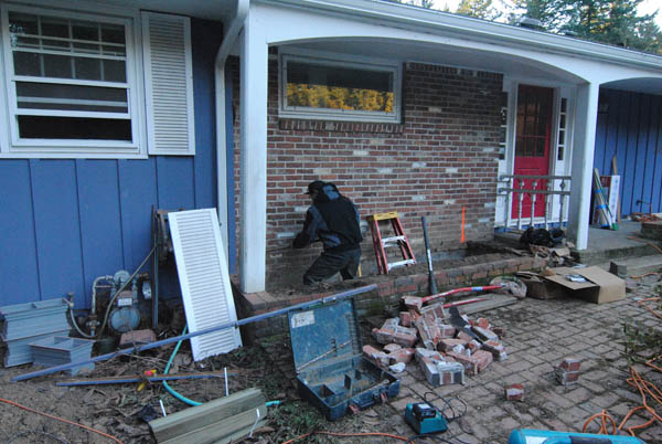 Preparing to remove the brick.