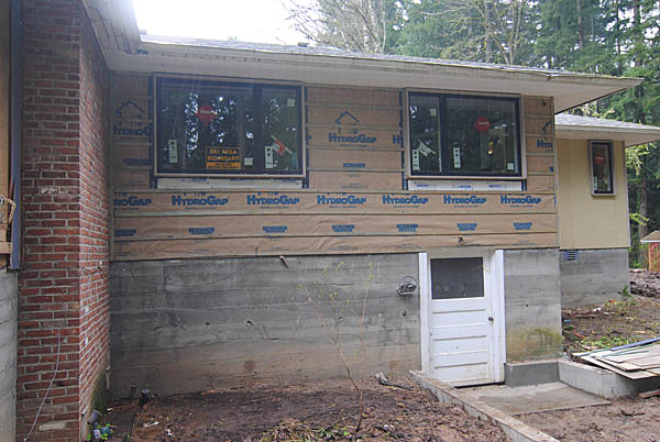 These are the bedroom windows on the back elevation. They have their trim and the wall is ready for siding.